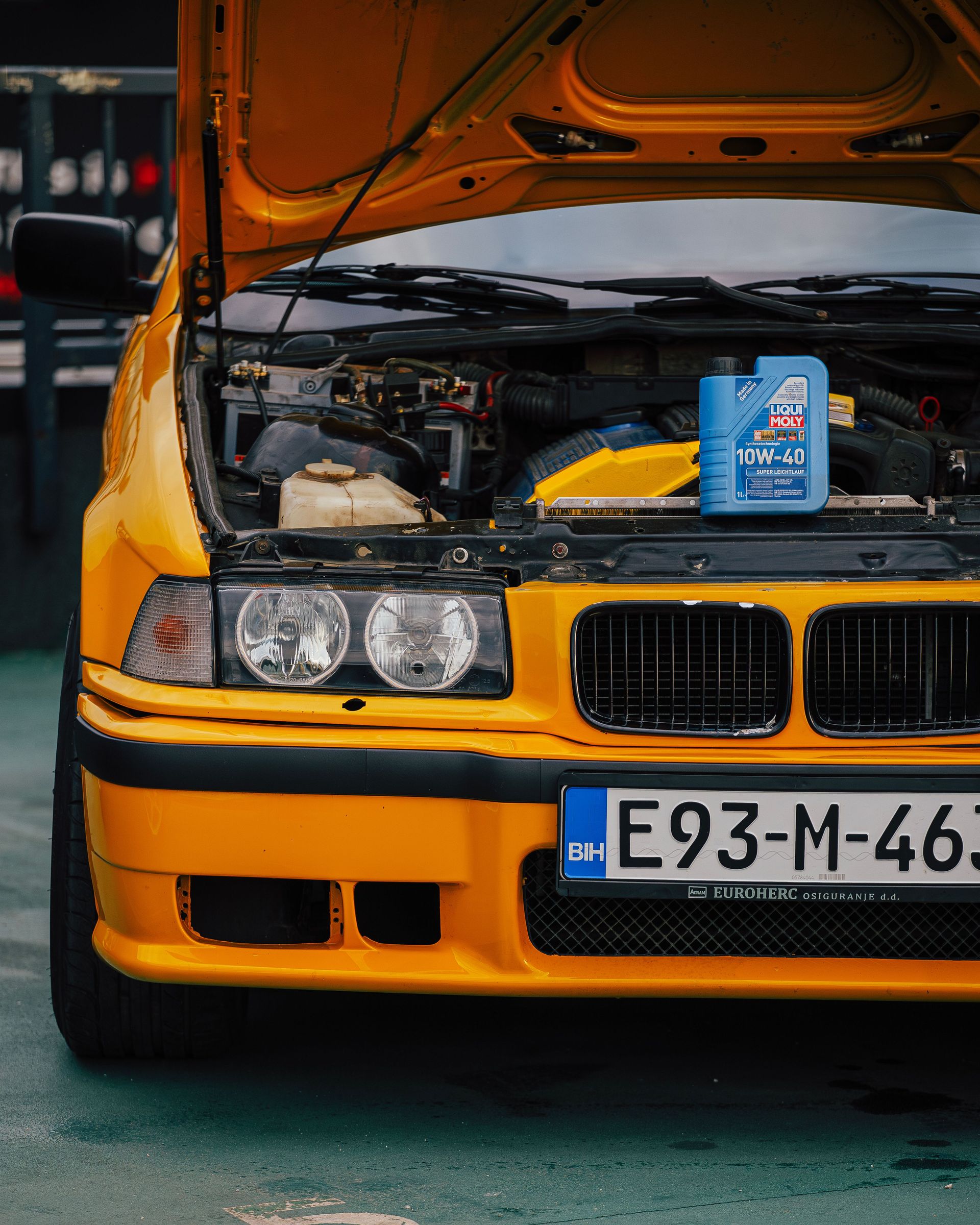 Close-up of car engine and motor oil can at a garage in Sarajevo.